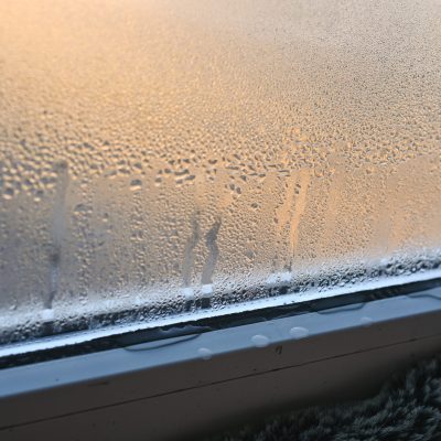 Drops of condensate on a metal-plastic window.